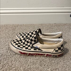 Vans Black and White Checkerboard Slip-Ons with Red Accents